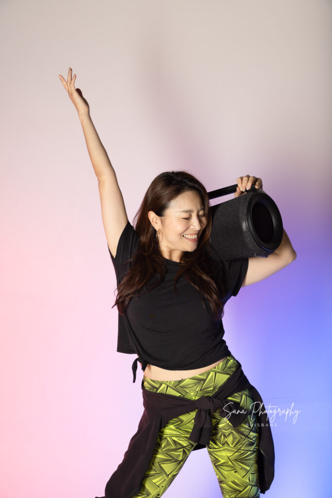 zumba teacher business portrait with coloured background studio shooting in Brisbane